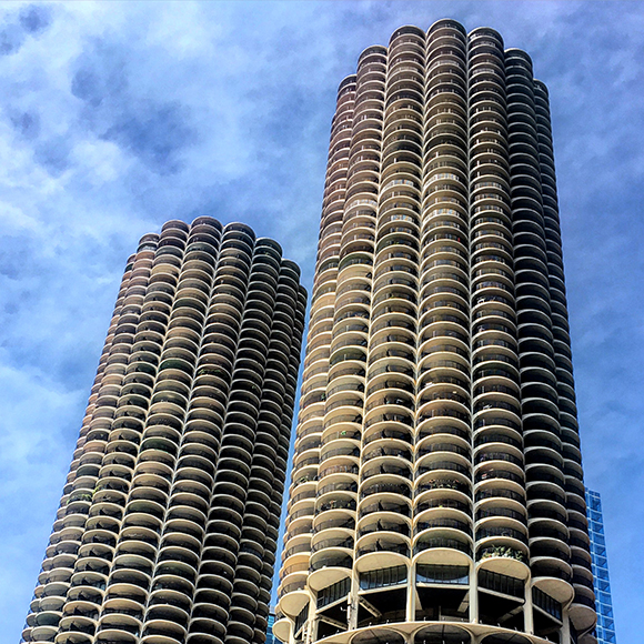 View of Marina City while on river cruise. It was designed by Bertrand Goldberg in 1968 and was the first building in the United States to be constructed with tower cranes.